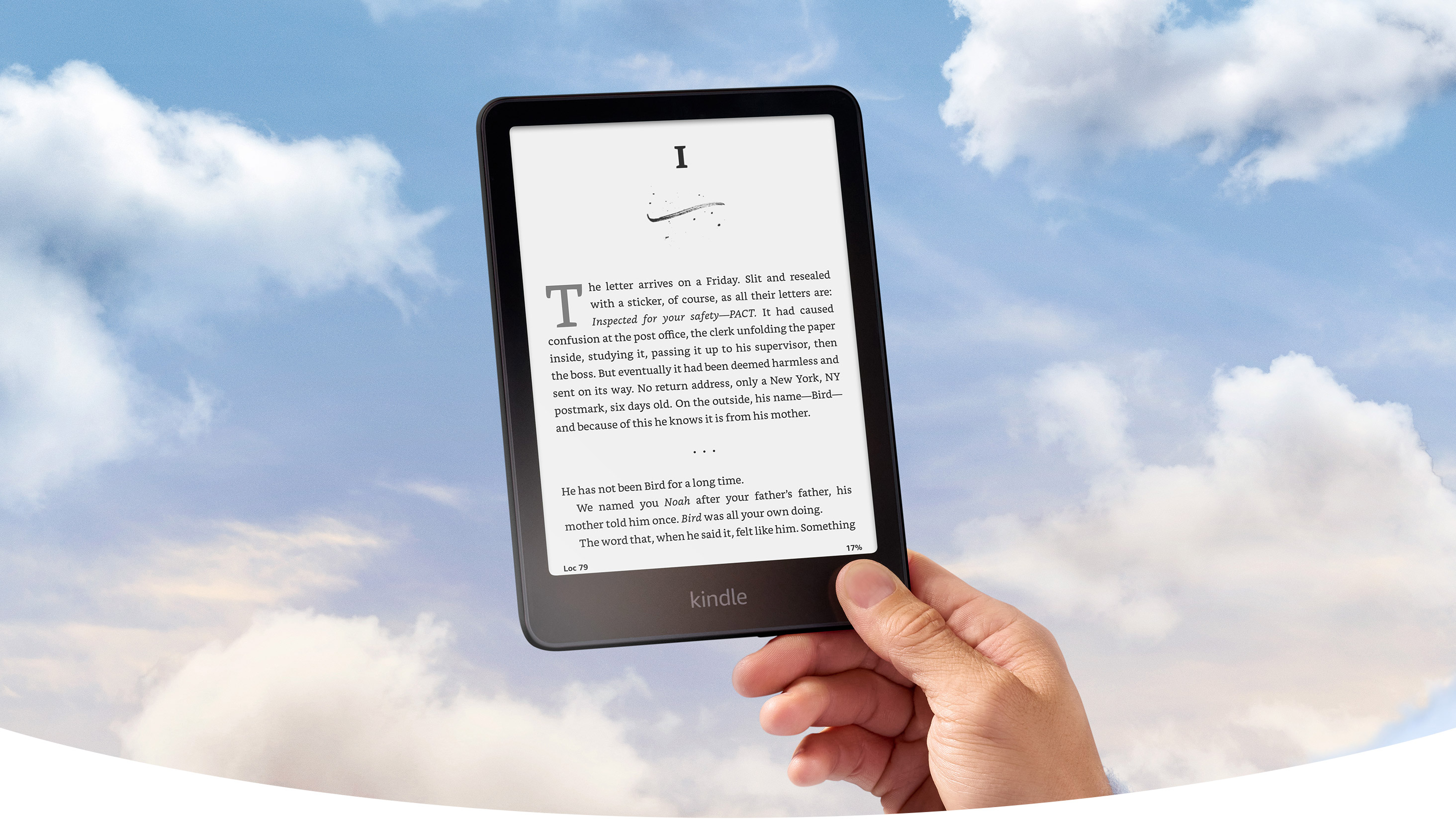 A hand holds Kindle Paperwhite against a blue sky with clouds. A chapter book is on screen.