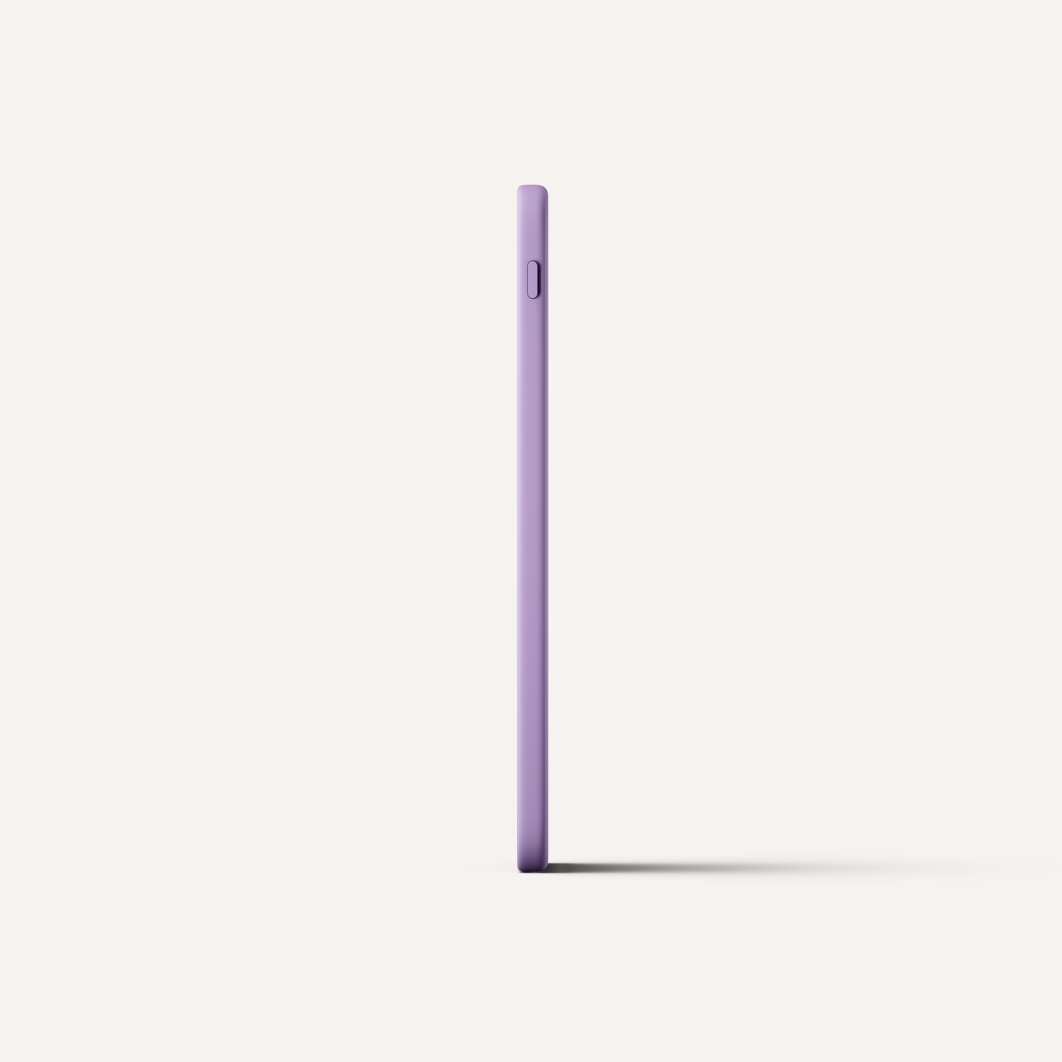 A purple Kindle standing on end, showing how thin it is.
