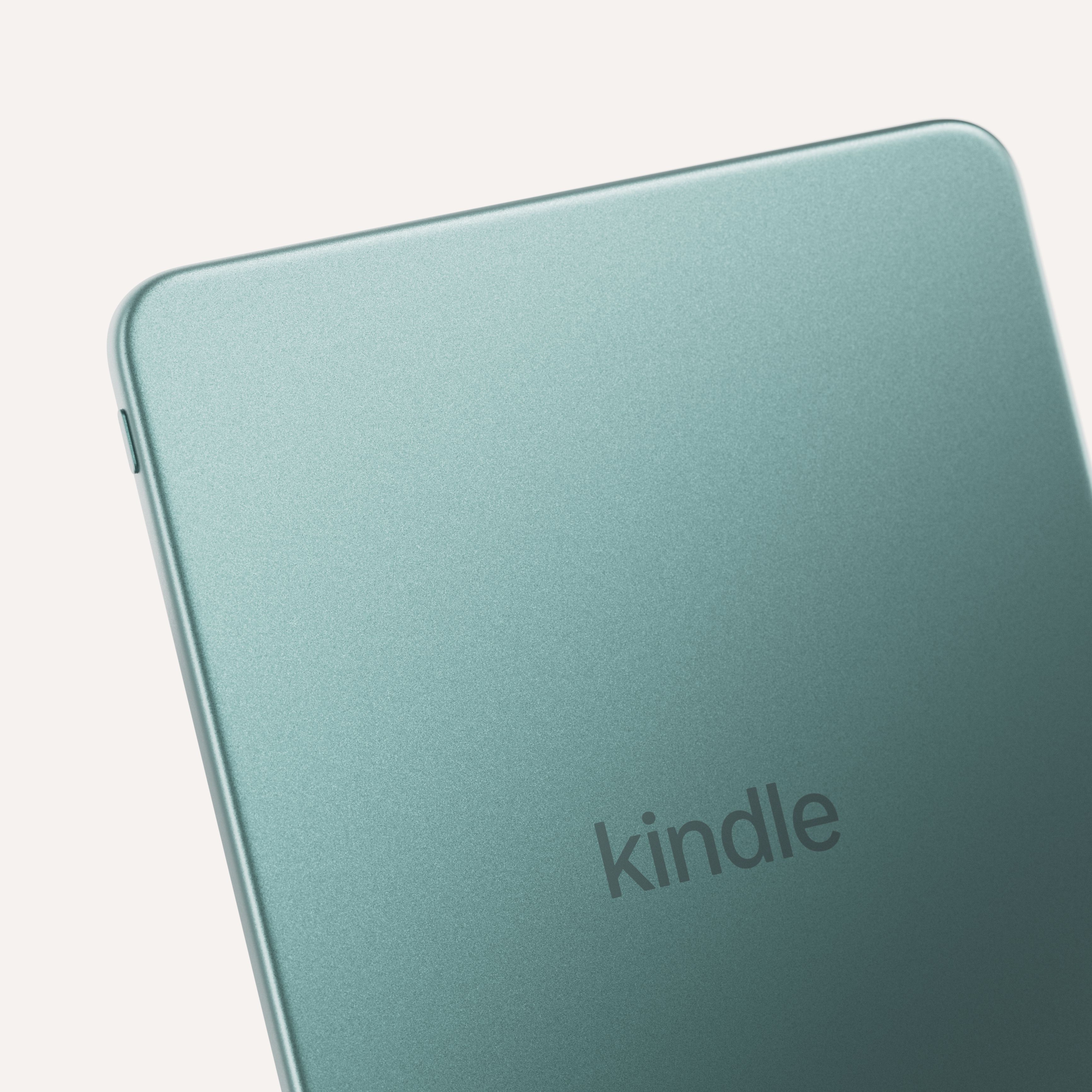 Amazon Kindle e-reader with rounded corners and power button on bottom edge in light blue.