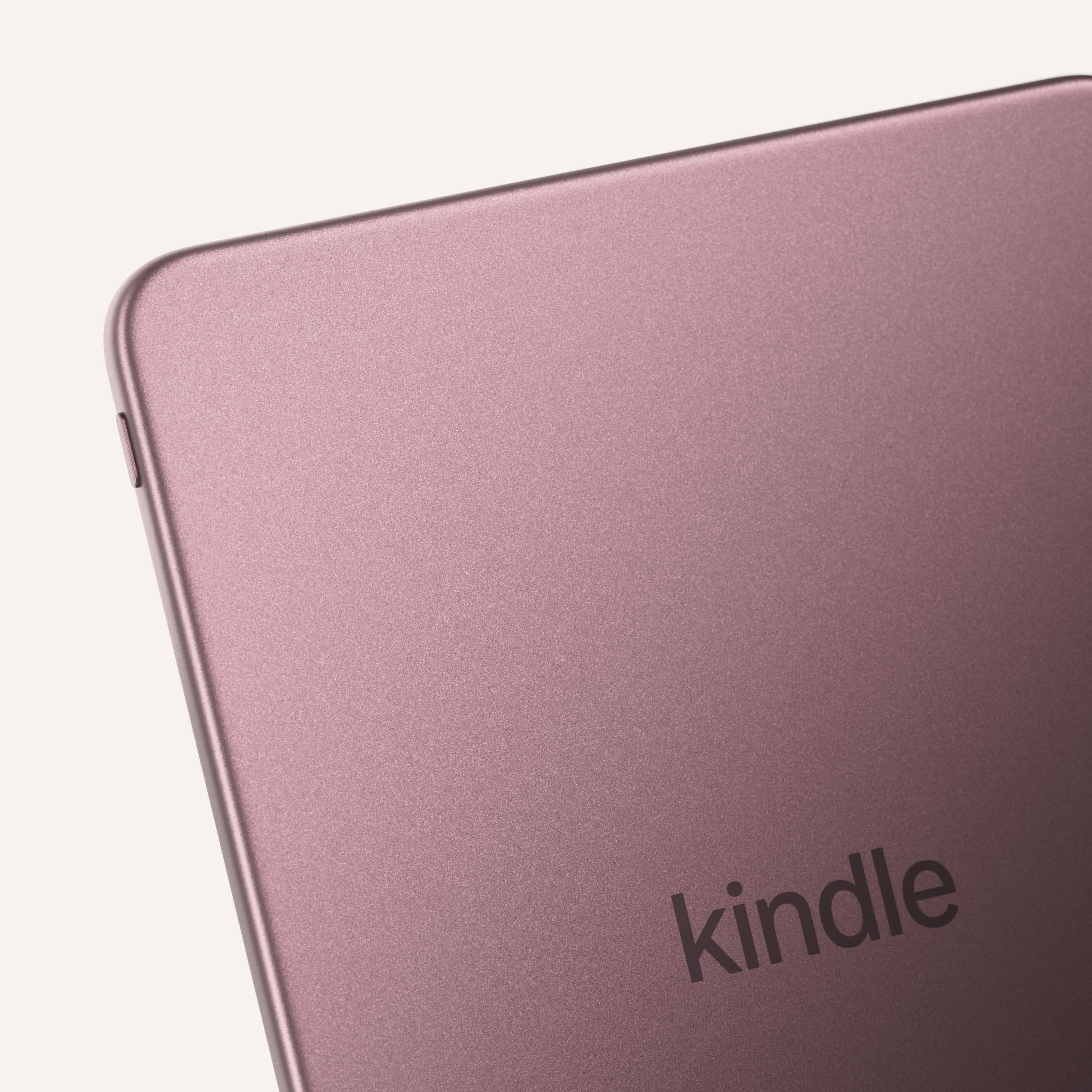 Close-up of Kindle Colorsoft Signature Edition corner in metallic rose showing rounded edges and Kindle logo.
