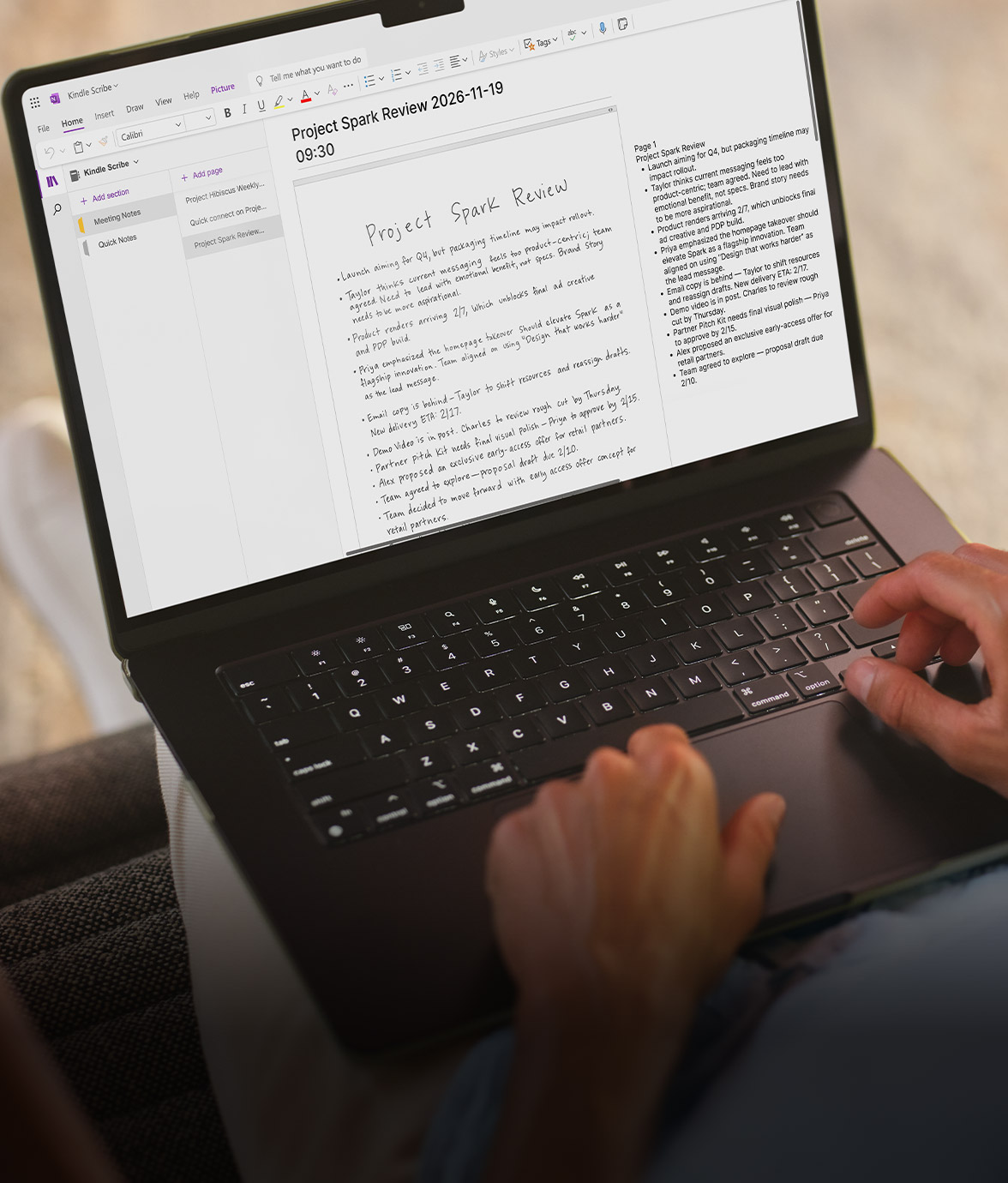 Person using a laptop with Microsoft OneNote open, showing handwritten notes synced from Kindle Scribe without front light.